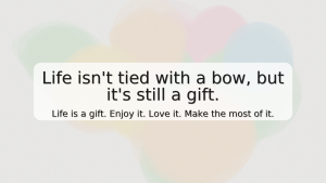bright watercolor collage background with soft peach, yellow, mint, blue, lavender, and pink; centered semi-transparent box with the quote, “Life isn’t tied with a bow, but it’s still a gift. Life is a gift. Enjoy it. Love it. Make the most of it.”